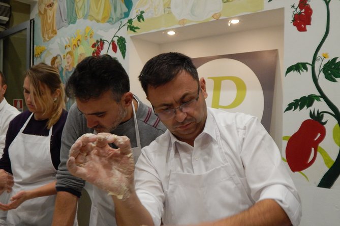 Italian Pizza Cooking Class with Chef Francesco in Padova - Stretching the base and learning to use the peel