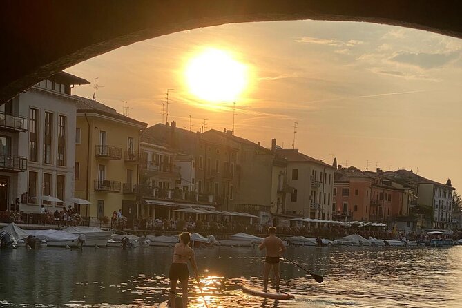 Sup experience with a ride to Peschiera del Garda Lake Garda - Learning the board with Alvin or Michael