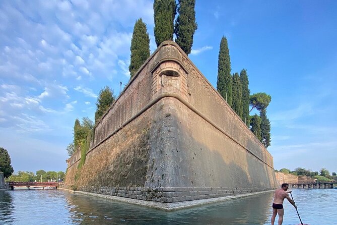 Sup experience with a ride to Peschiera del Garda Lake Garda - Paddling beneath bridges and along the canals