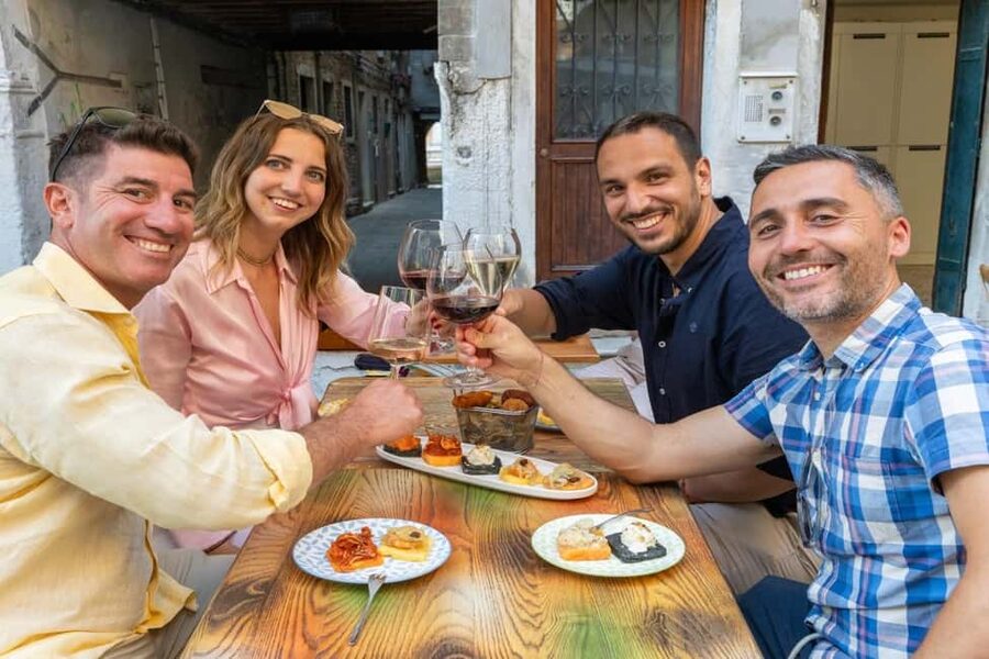 Venice Food Tasting Tour: Bites, Wine, Dinner & Local Guide - Stop two: fish cicchetti and an ombra of wine