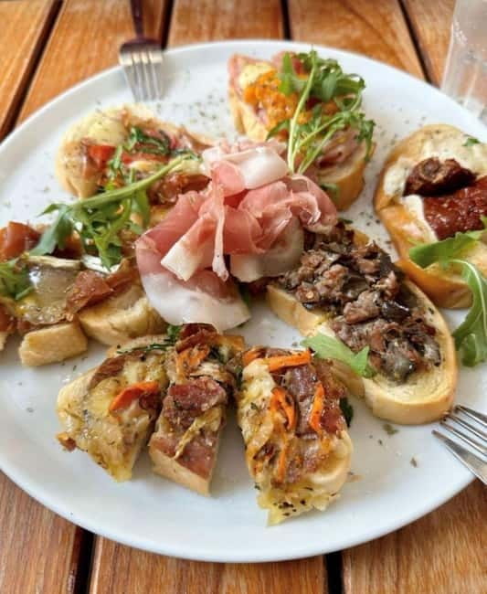Venice: Rialto Market Street Food Tour - Stop two: cheese and regional foods at Aliani Casa Del Parmigiano