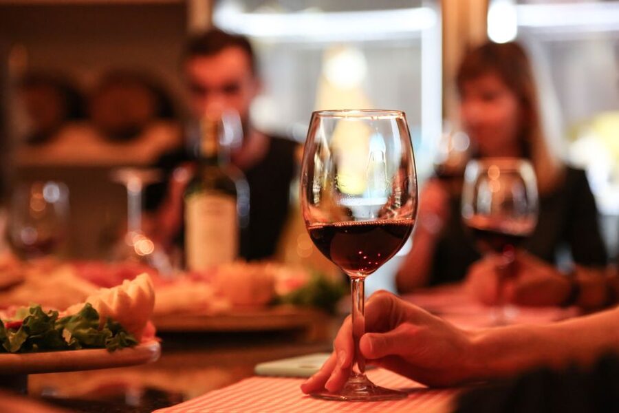 Verona: Classic Valpolicella Wine Tasting Experience - The local food plate beside your glass