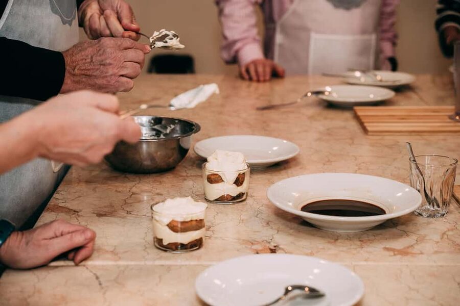 Verona: Hands-on Fresh Pasta and Tiramisù Cooking Class - Sitting down to eat what you made