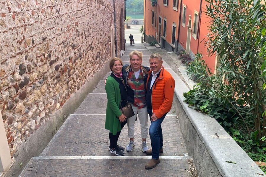 Verona: Highlights and Panorama Bike Tour - Crossing Ponte Pietra toward the Roman Theatre