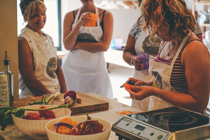 Verona: Italian Cooking Class with Pasta, Risotto and Tiramisù - Sitting down to eat your handmade lunch