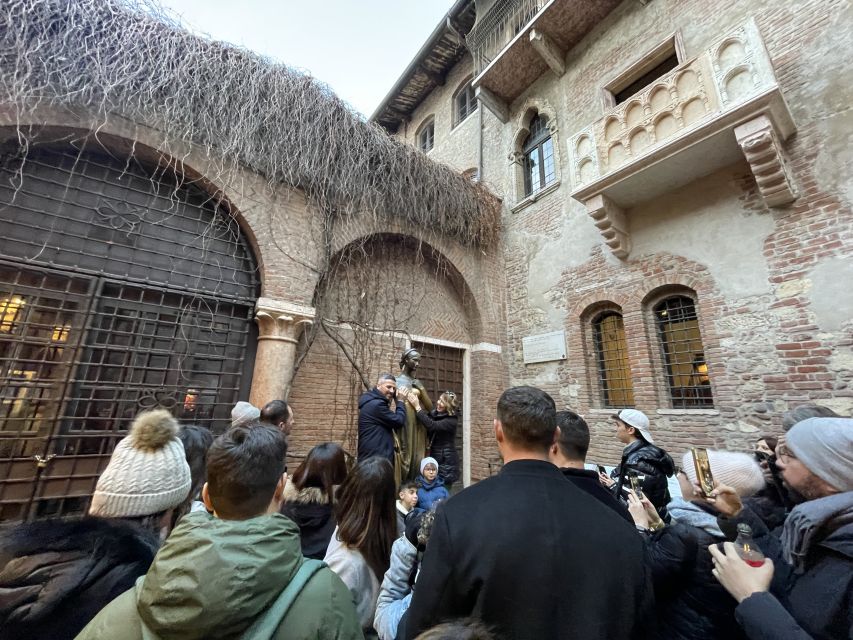 Verona: Small Group Guided Walking Tour with Arena Tickets - Piazza delle Erbe and the everyday side of Verona